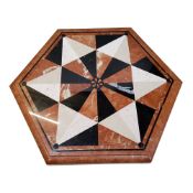 A large hexagonal pietra dura table top, inset with belge noir, sienna and white marble specimens to