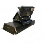 A Polaroid SLR 680 Instant Camera, boxed
