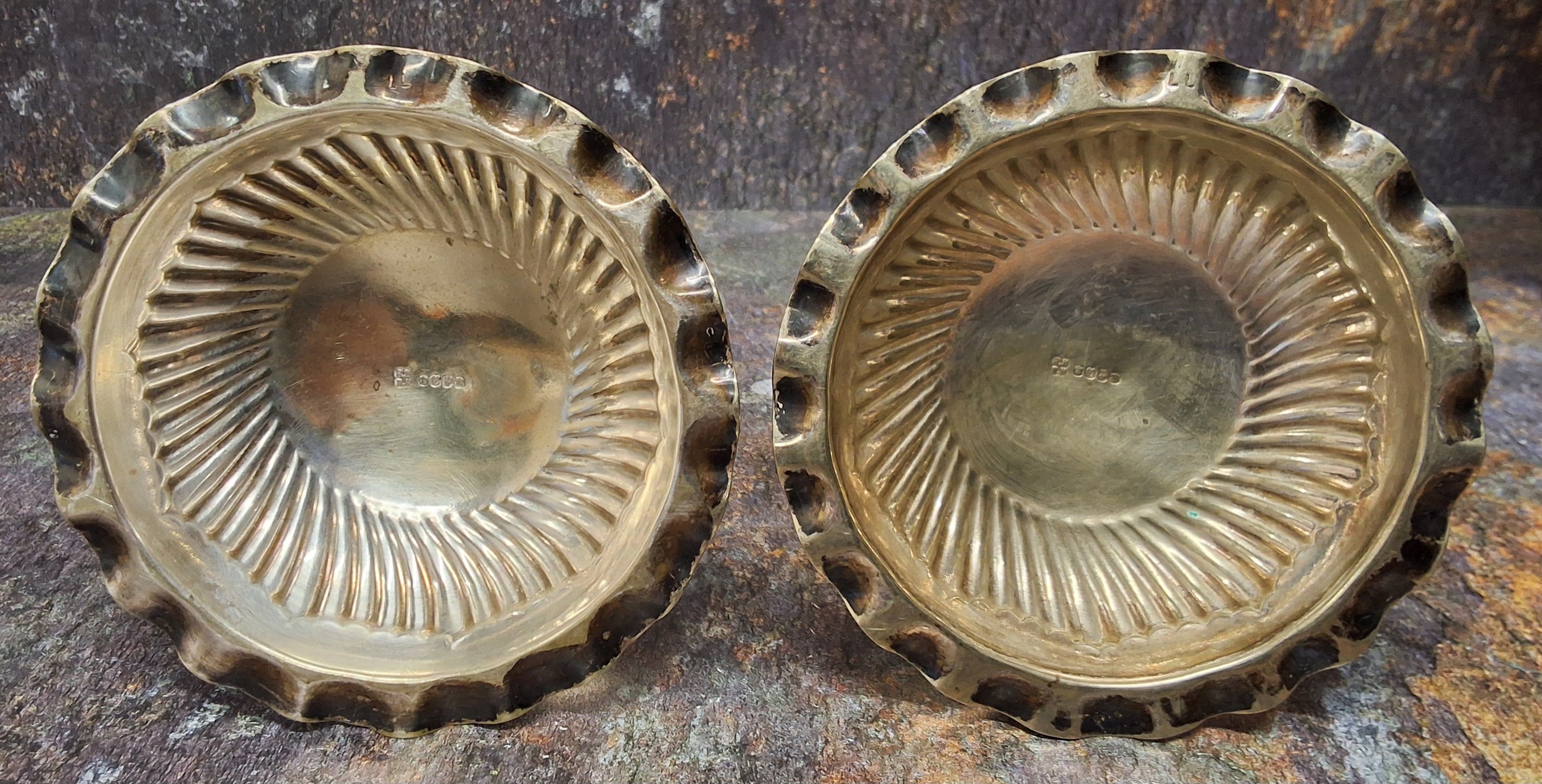 A pair of late 19th century plated candlesticks, spirally fluted columns, low drip plates, domed - Image 2 of 2