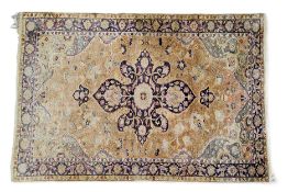 A 19th century Persian silk rug, the central panel  with floral medallion,  in blue, red and