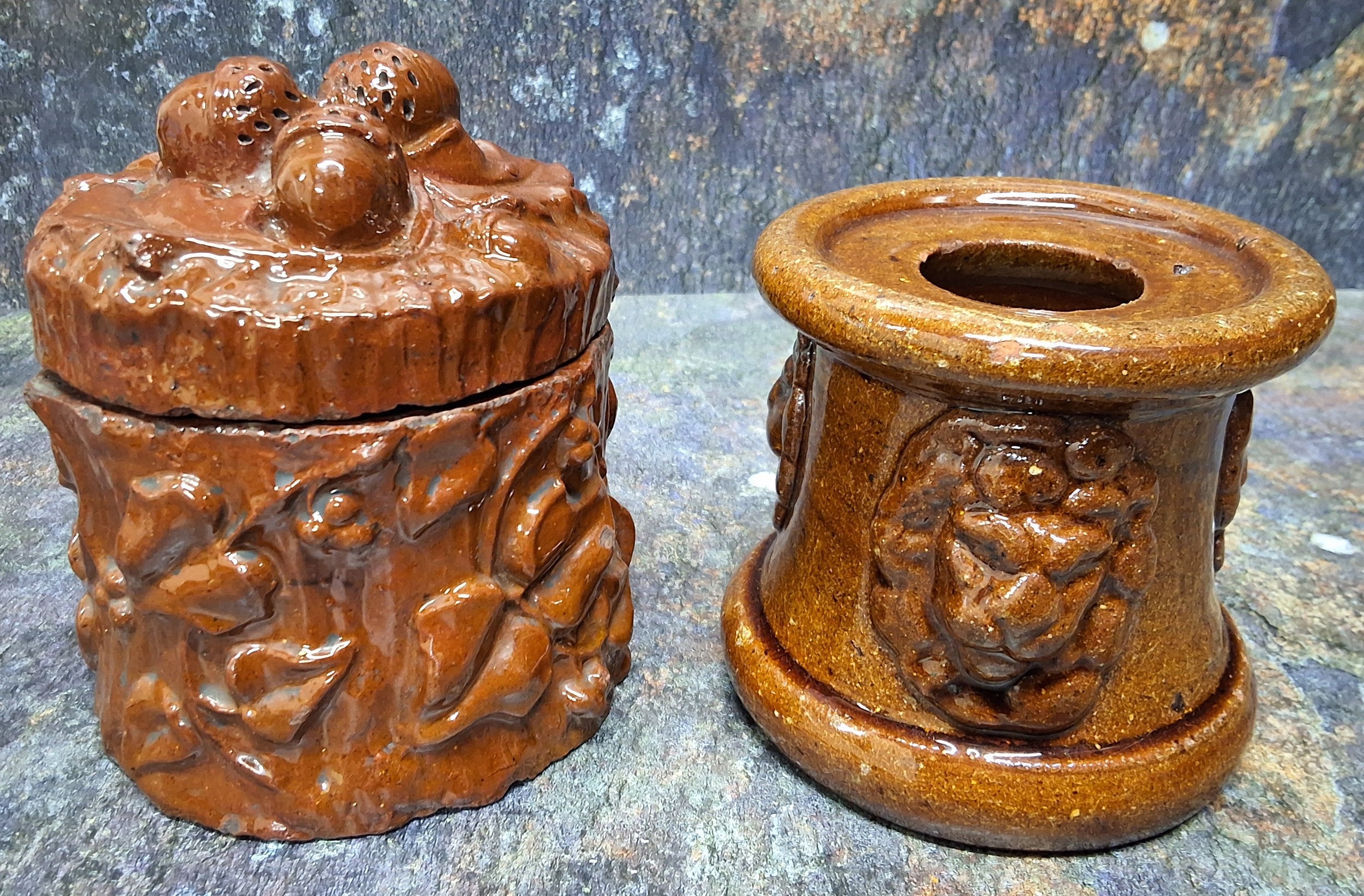 A 19th century brown salt glazed stoneware tobacco jar, in relief with foliage, the cover with three