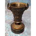 A 19th century bronze urn, of waisted cylindrical form, cast with scrolling foliage, scroll handles,