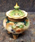 A Hadleys Worcester pot pourri vase and cover,  painted with roses and berries, four scroll feet,