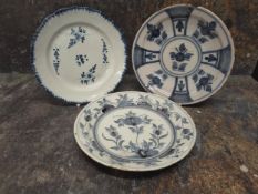 An 18th century Delft plate, decorated in underglaze blue with stylised flowers and foliage, 23.