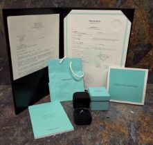 A Tiffany & Co platinum and diamond solitaire, claw set brilliant cut round diamond, 0.25ct, 4.