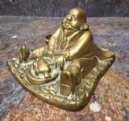 A 19th century brass novelty inkwell, cast as a portly gentleman, seated, 15cm wide, c.1860