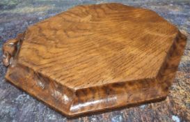 Robert Thompson, Mouseman of Kilburn - an oak octagonal cheese board, 30.5cm long, carved mouse