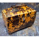 An early Victorian tortoiseshell bowed rectangular tea caddy, hinged pagoda top, two lidded