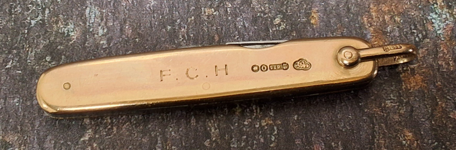 A 15ct gold two blade pocket knife, by Goldsmiths, London, lanyard ring, 6cm closed, 18g gross
