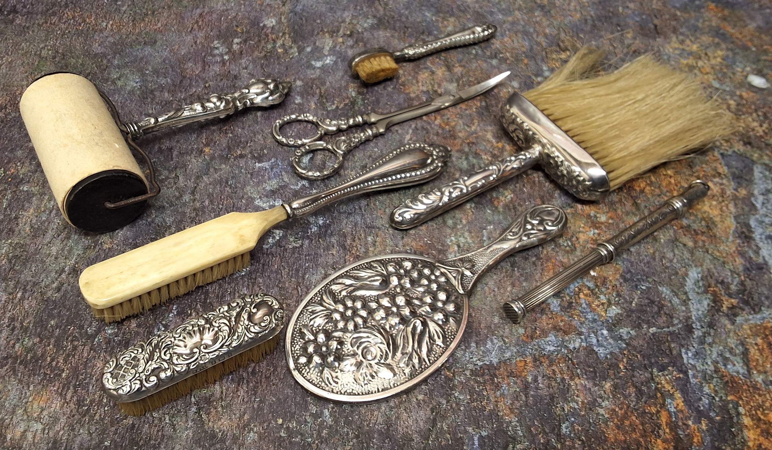 An American sterling silver hafted roller desk blotter, 12.5cm long; silver hafted scissors, 12cm