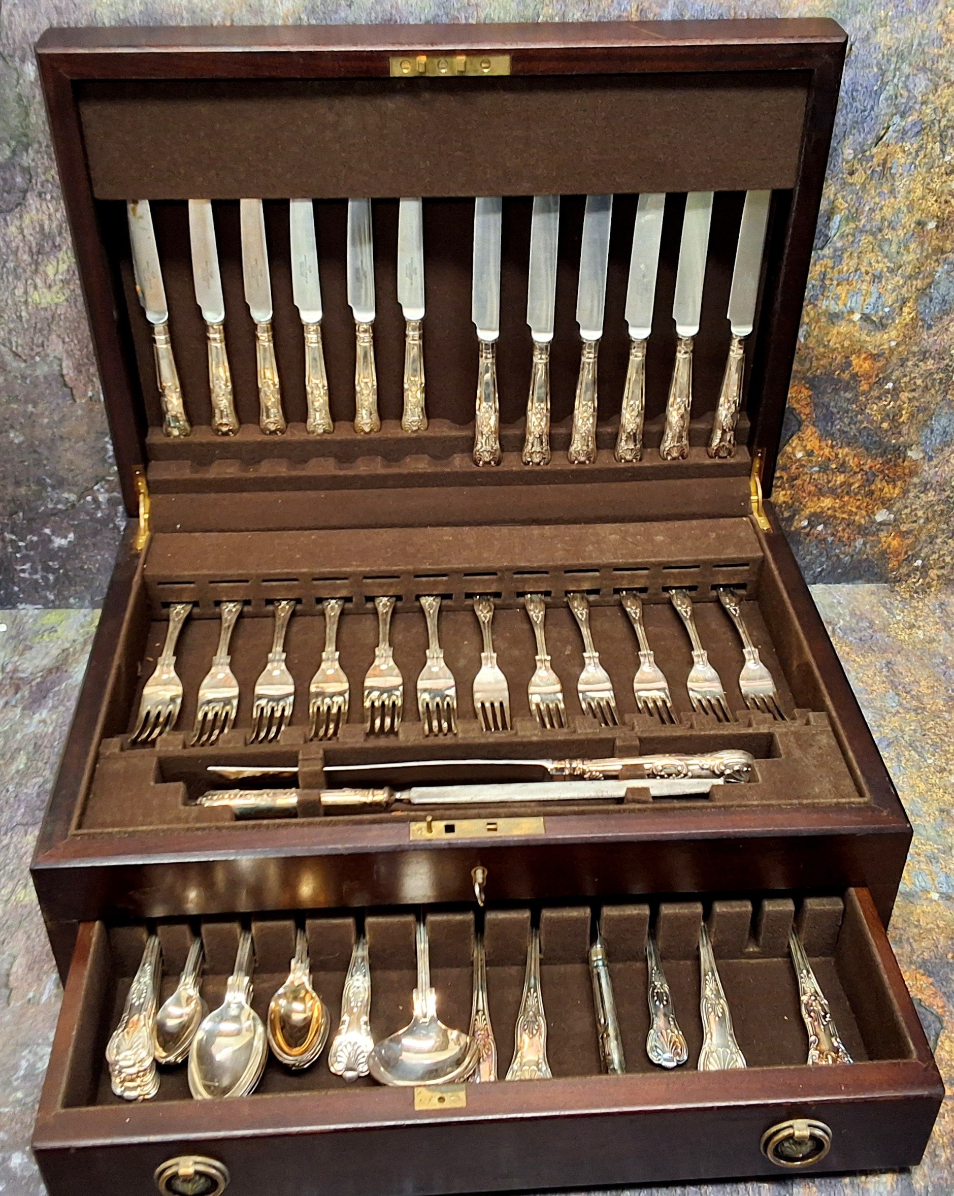 An E.P.N.S. Kings pattern canteen, for six, comprising soup spoons, dinner knives and forks, dessert