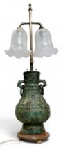 A 'Chinese' Archaic bronzed side light, cast with symbols and character marks, loose ring handles,