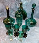 A 19th century bottle shaped emerald decanter, Scotch stopper, 25.5cm high, c.1850; another; a