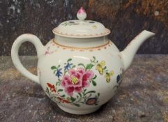 A Worcester teapot and cover, painted in famille rose style with a large chrysanthemum and other