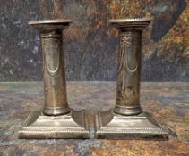 A pair of silver candlesticks, detachable nozzles,