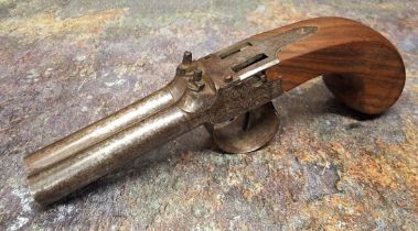 A Victorian percussion double barrelled muff pistol, foliate engraved side plates, walnut grip, 19.