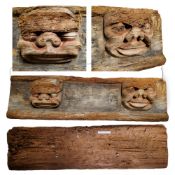 A large 16th / 17th century Continental carved oak panel, traces of polychromy on the two masks, the