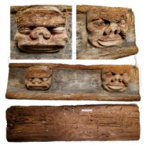 A large 16th / 17th century Continental carved oak panel, traces of polychromy on the two masks, the