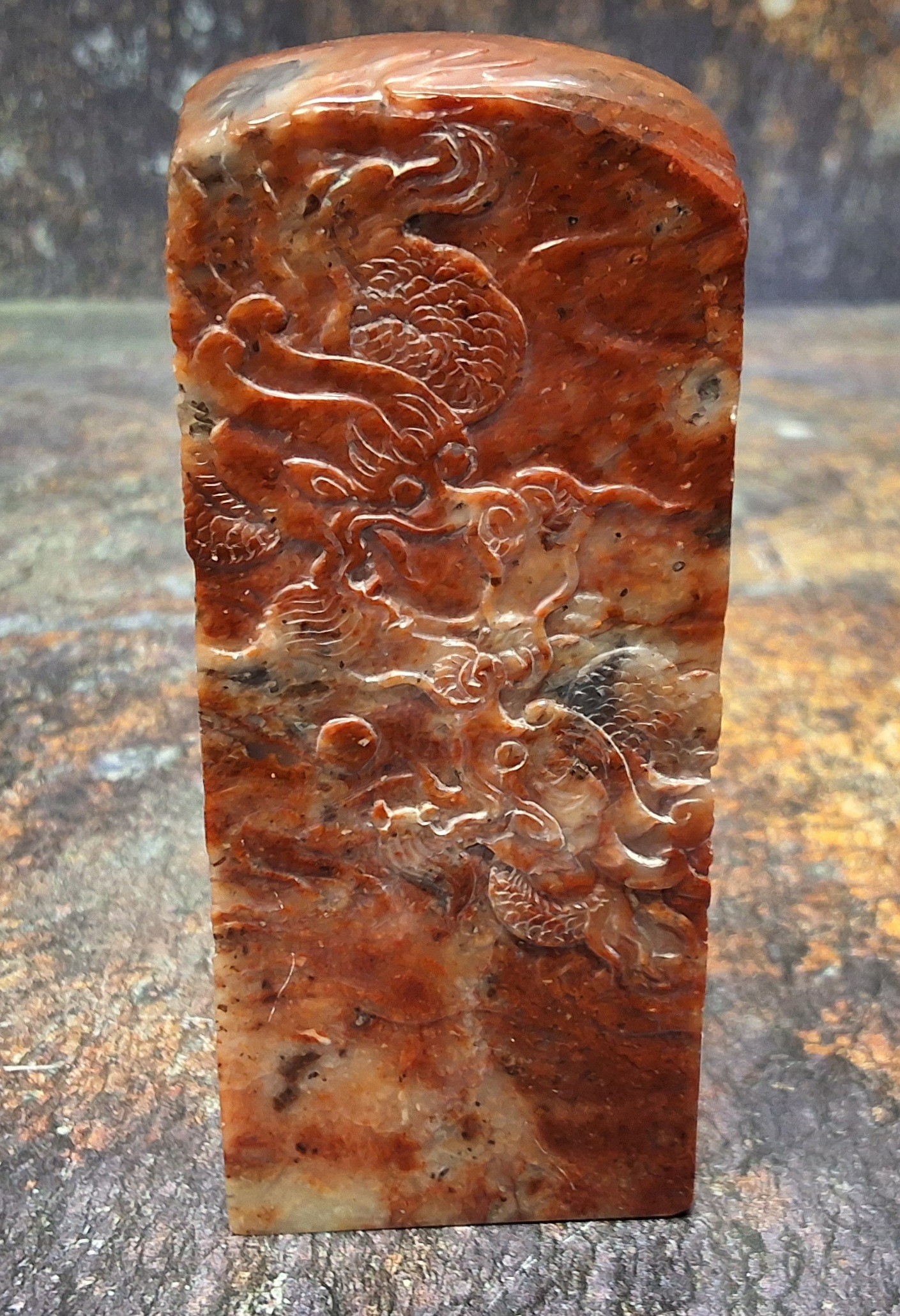 A Chinese hardstone seal, carved scrolling dragons, 9.5cm high