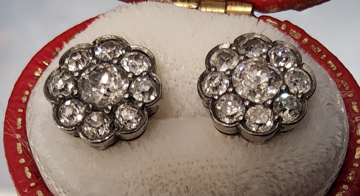 A pair of 18ct gold & diamond cluster earrings, each set with a central round diamond approx. 0. - Image 2 of 2