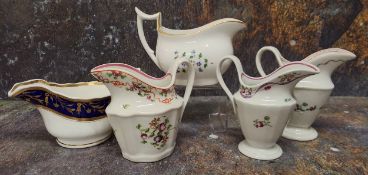 A Newhall helmet shaped fluted cream jug, painted with floral sprigs, 12cm high, c.1790; another,