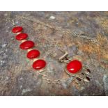 A silver mounted and red stone bracelet and conforming pendant, marked 925