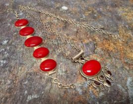 A silver mounted and red stone bracelet and conforming pendant, marked 925