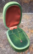 A Gucci Le Marche des Merveille 18ct gold necklace, stamped Gucci, 750, a white metal pendant in the