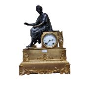 A French gilt metal and bronzed clock, the dial with Arabic numerals, twin winding holes, striking