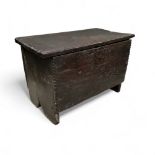 A late 16th / early 17th century English boarded oak box, single plank construction throughout, 37cm