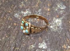 An early Victorian 9ct rose gold ring, the setting in the form of a horseshoe set alternately with