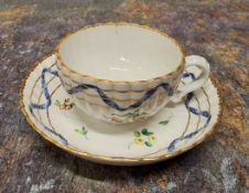A Bristol fluted teacup and saucer, from the Hilaire, Countess Nelson service, painted with