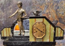 An Art Deco spelter, onyx and marble clock garniture, the gilt octagonal face with Arabic
