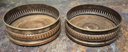 A pair of early 20th century E.P. on copper bottle coasters, bowed pierced sides, draught turned