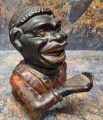 A Victorian cast iron Jolly Black Man money bank, 15cm high