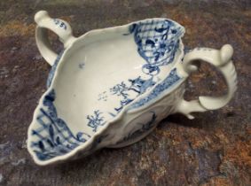 A Worcester two handled sauceboat, painted with the Two Handled sauceboat landscape with four