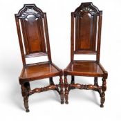A pair of 17th century Charles II oak hall chairs c.1680, 120cm high, 46cm wide, 53cm deep, seat