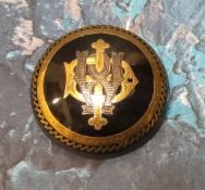 A Victorian circular tortoiseshell mongramme brooch pique inlaid with yellow and white metal
