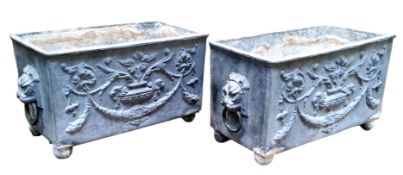 A pair of 19th century lead planters, cast with Neoclassical flowering urn, lion mask and ring