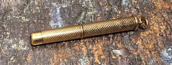 A 9ct gold tooth pick, engine turned, with jump ring, 7.5cm long open, 6g