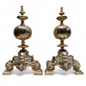 A good pair of 17th century bronze Renaissance andirons, with lofty finials, above globular balls