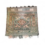 A Middle Eastern woollen salt bag, with central lozenge, geometrical banded border, 71cm x 77cm