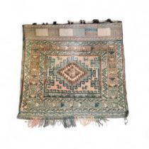 A Middle Eastern woollen salt bag, with central lozenge, geometrical banded border, 71cm x 77cm