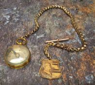 An early 20th century gilt metal compass, on gold plated Albert, George Washington shield shaped fob