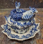 A Dutch Delftware fish sauce tureen, cover and stand, Jan van der Kloot, painted in shades of cobalt