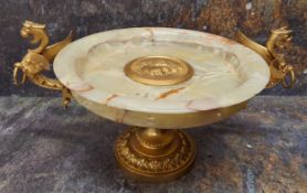 An Italian onyx and gilt bronzed comport/tazza, the centre set with roundel in relief with Roman,