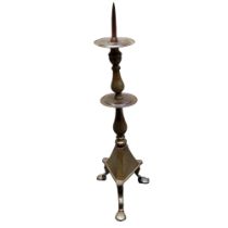 A large 18th century Eastern bronze pricket stand, chased throughout with cows, exotic birds and