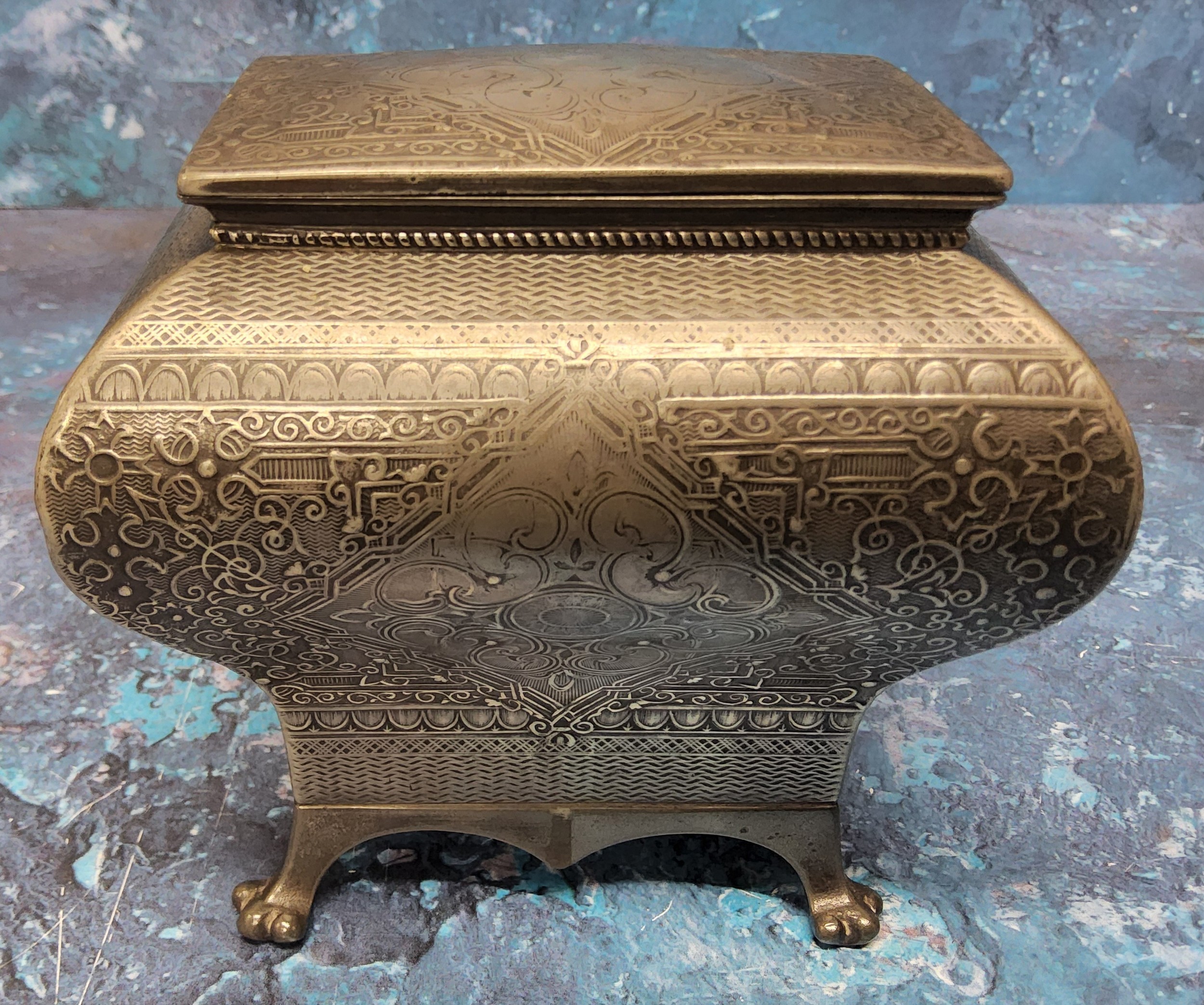 A late 19th century pewter bombe tea caddy,  engraved with foliate scrolls within a basket weave - Image 4 of 5