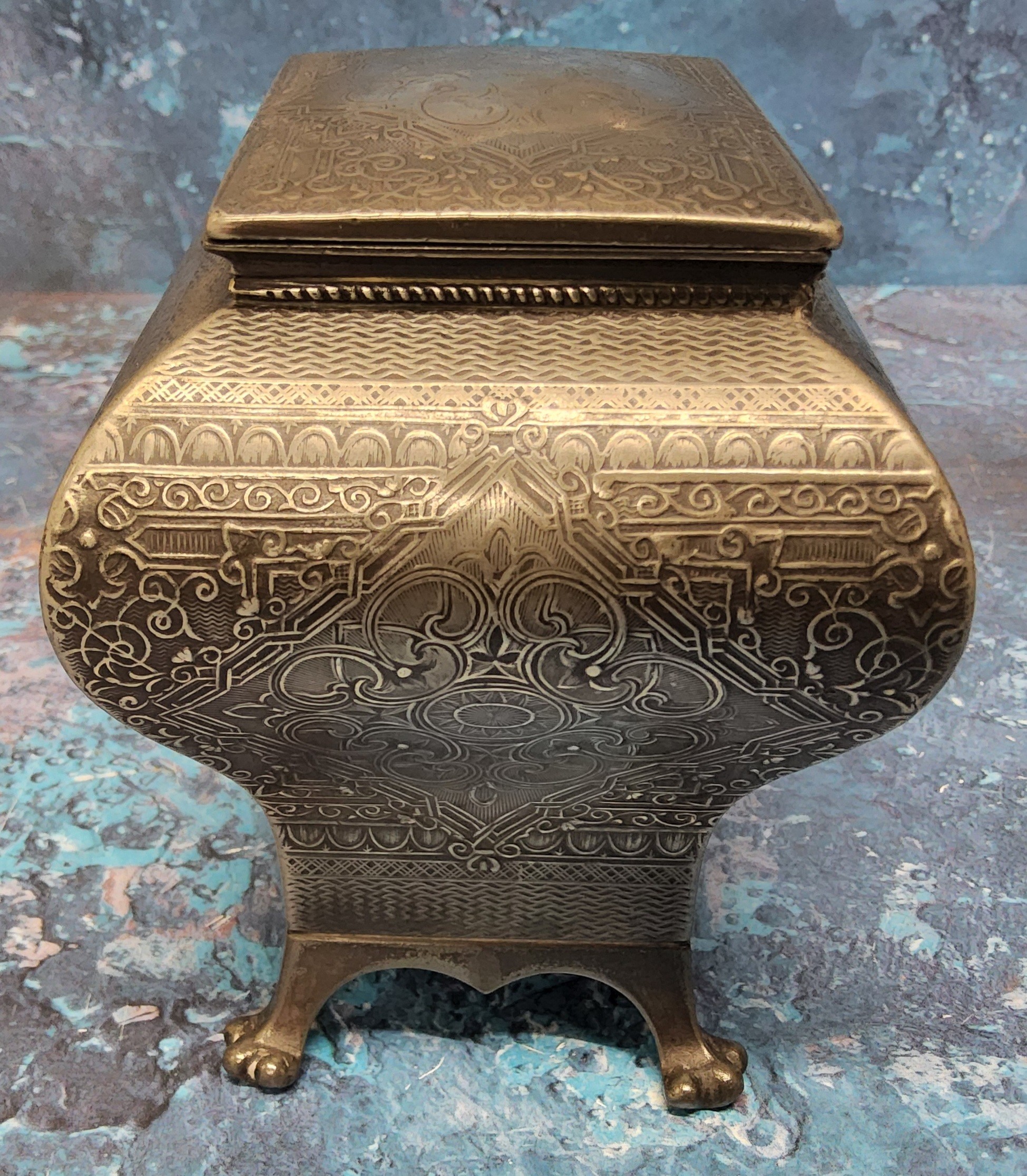 A late 19th century pewter bombe tea caddy,  engraved with foliate scrolls within a basket weave - Image 5 of 5