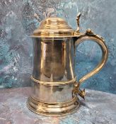 A George II silver spreading cylindrical tankard, hinged domed cover, scroll handle with heart